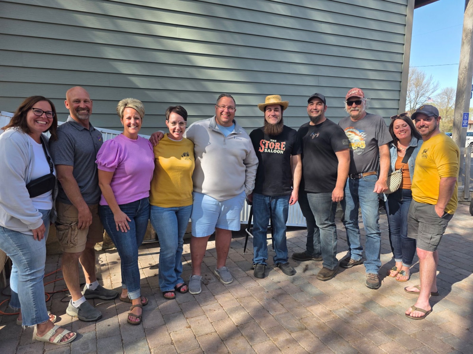A group photo outside the saloon